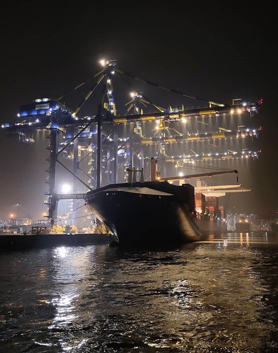 Container vessel at a port terminal during night operations